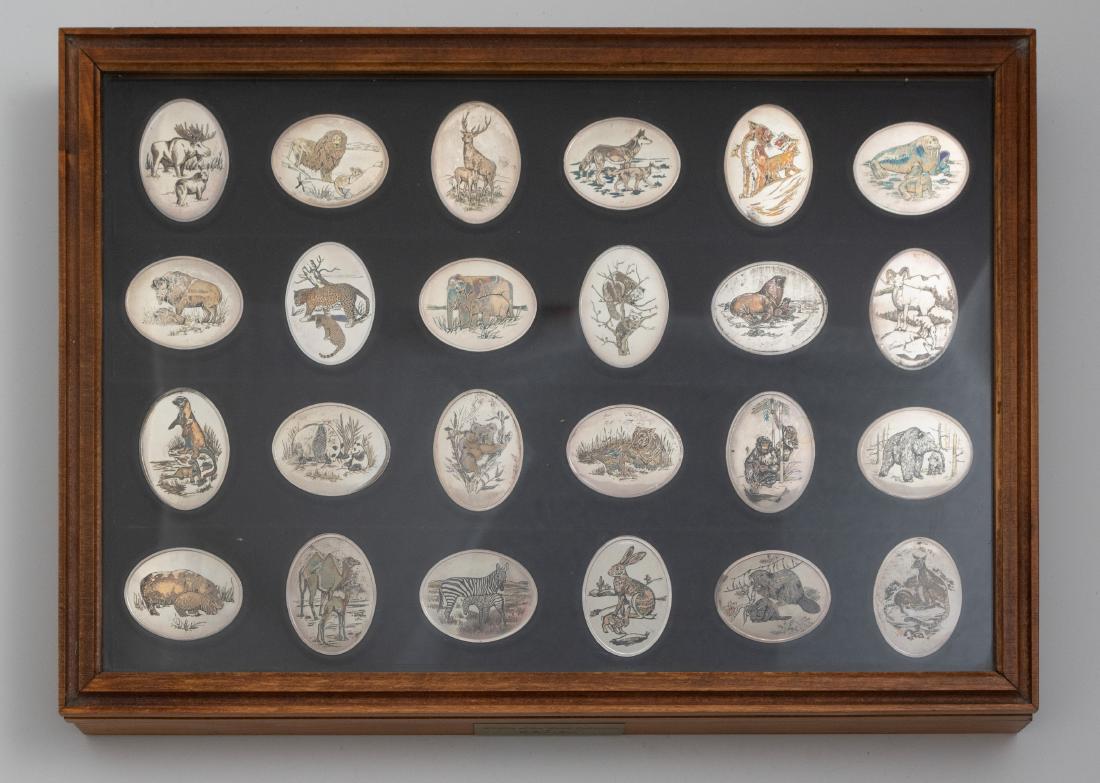 (24) Danbury Mint Sterling Silver Wildlife Ingots: (24) Danbury Mint Sterling Silver Wildlife Ingots, titled, "Wildlife of the World Collection". Each depicts the engraved image of an animal with details in gold lustre, black, and green. The collectio