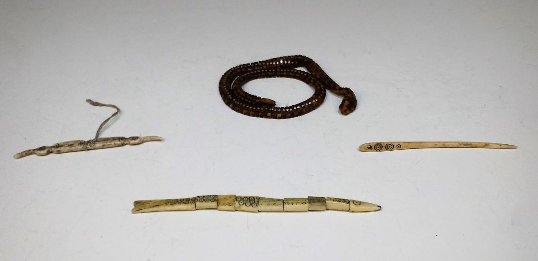 Carved Horn & Bone Articulated Snakes & Fish: Carved horn and bone articulated animals: vintage folk-art snake with articulated links made of horn, decorated with metal and beadwork. Snake coils naturally and looks disturbingly realistic. Dimensi