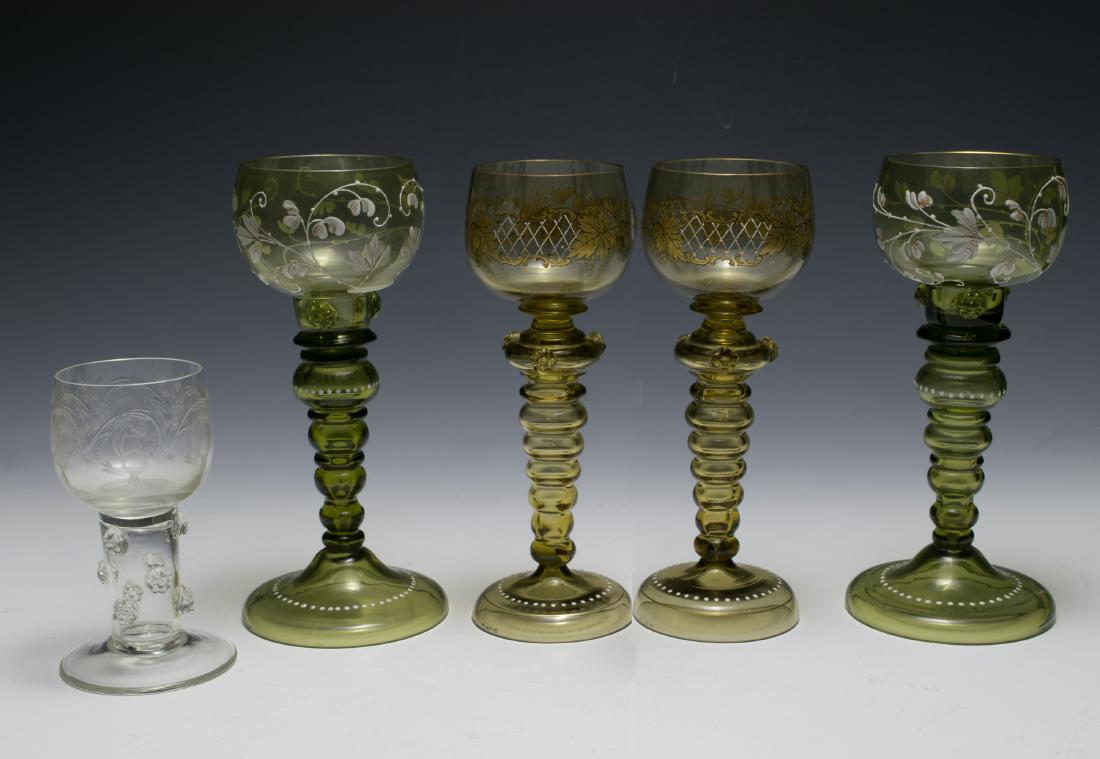 Five Moser Wine Glasses: Moser Glassworks, Bohemia. Five have hand enameled decoration and one is clear with etched bowl. Dimensions are: largest 7 1/2" tall, 3 1/2" dia. base. All measurements are approximate. Condition: A c