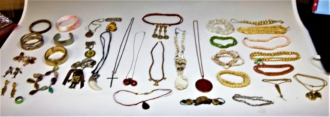 23 Necklaces, 7 Bracelets, 3 Pair Earrings, 1 Ring: 23 necklaces, 7 bracelets, 3 pairs of earrings, and a ring, in materials including bone, shells, metal, metal chain, glass and stone beads, and resin. Dimensions are: the longest necklace is 14 1/2 in