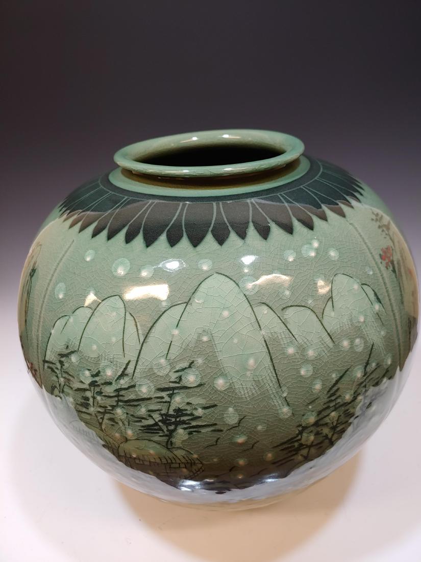 Large Korean Sanggam Celadon Vase: Large Korean Sanggam Celadon Vase with four seasons panels. 2-character mark on base. Dimensions are: 12 3/4 inches high X 13 5/8 inches diameter. All measurements are approximate. Condition: Cracklin
