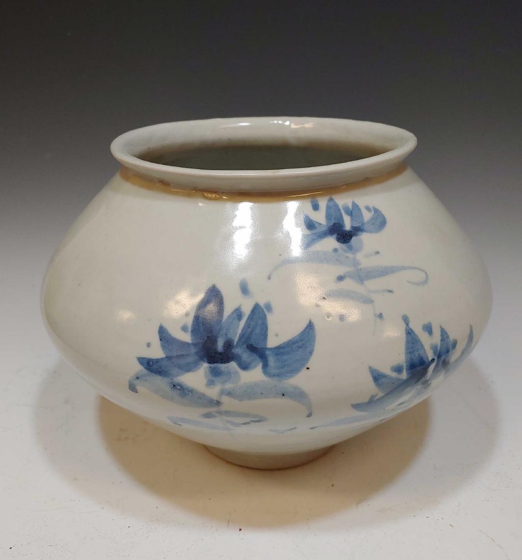 Korean Ceramic Blue & White Moon Jar Flowers: Korean Ceramic Blue & White Moon Jar Flowers: Hand painted in blue glaze on a white ground with moon flowers. Signed on the base by the artist. Dimensions are: 6 1/2 inches tall. All measurements are 