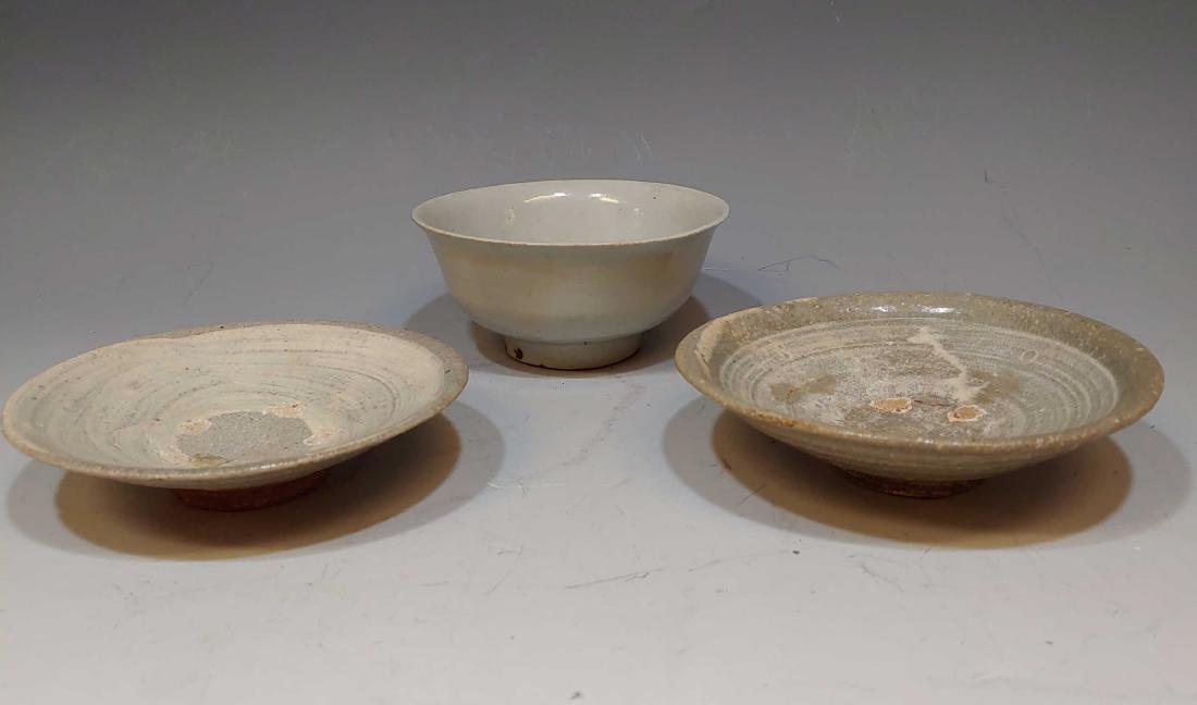 (3) 16th - 17th Century Korean Glazed Dishes: (3) 16th - 17th Century Korean Glazed Dishes: Includes one bowl and two plates. All dishes are earthenware glazed in shades of off-white. Dimensions are: bowl - 4 3/4 inches dia X 2 inches tall, large