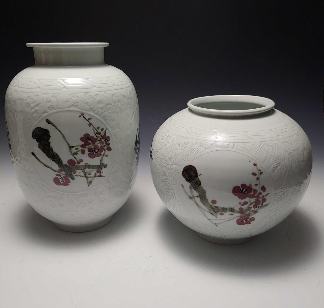 (2) Korean Porcelain Four Seasons Vases: (2) Korean Porcelain Four Seasons Vases: each with incised and painted decoration, which include panels dedicated to each of the four seasons. Each signed in characters on the base. Dimensions are: ta