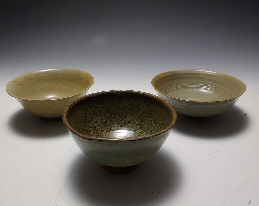 (3) 16th & 17th Century Korean Glazed Bowls: (3) 16th & 17th Century Korean Glazed Bowls: One bowl has a crackle glaze. Dimensions are: tallest - 3 3/4 inches tall X 6 1/2 inches dia, widest - 2 7/8 inches tall X 7 1/8 inches dia. All measuremen
