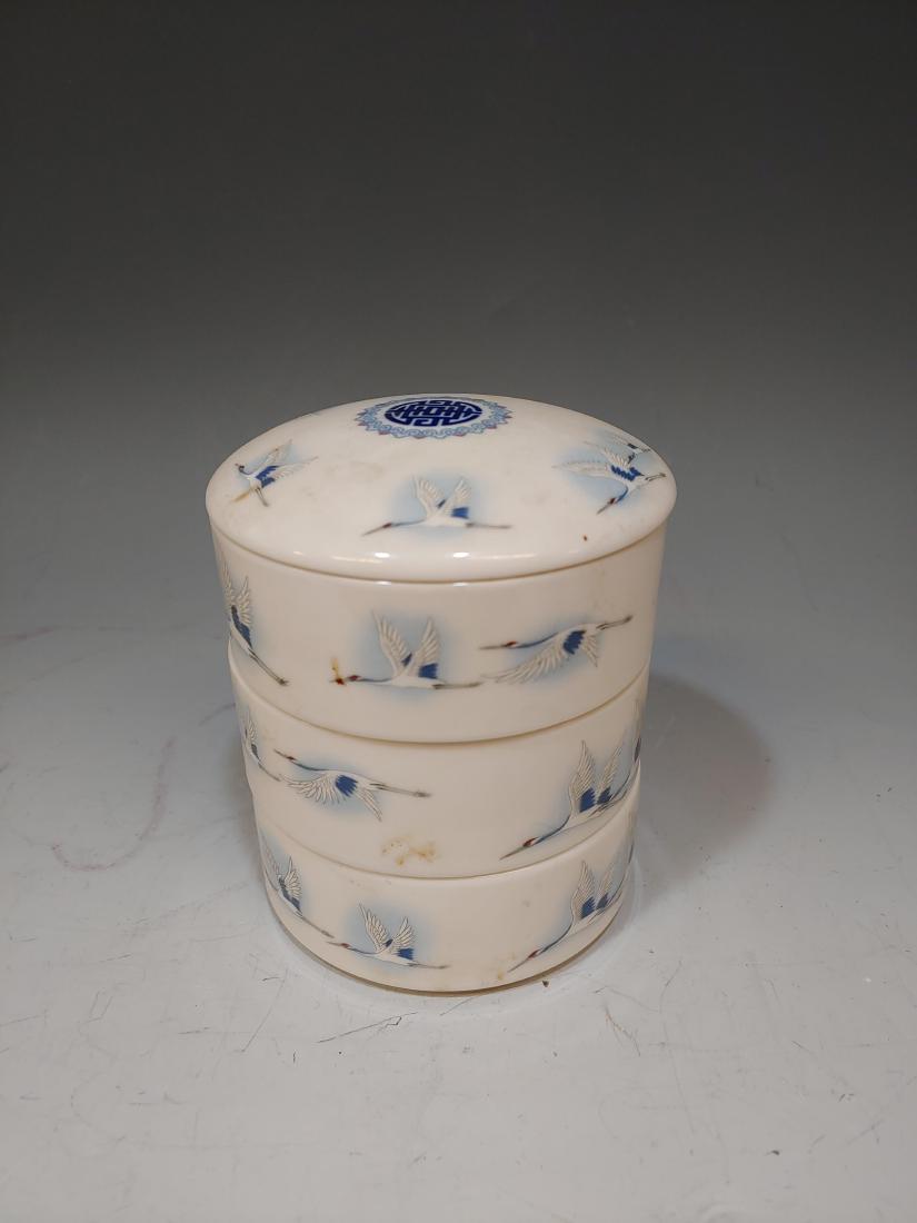 Korean Snow Bone China Stacking Jars: Dated 1942 with Crane motif. Marked on bottom of each jar: Snow Bone China, 1942, Haengnamsa. Dimensions are: 5 1/2 inches tall X 4 1/2 inches dia. All measurements are approximate. Condition: Free of