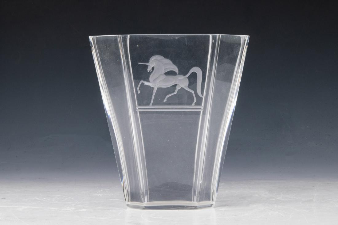 Steuben Vase with Intaglio Unicorn by Sidney Waugh: Steuben clear glass vase with intaglio unicorn motif, design by Sidney Waugh, signature inscribed on base. Dimensions are: 7 inches high X 6 1/2 inches long X 4 3/8 inches wide at mouth. All measureme