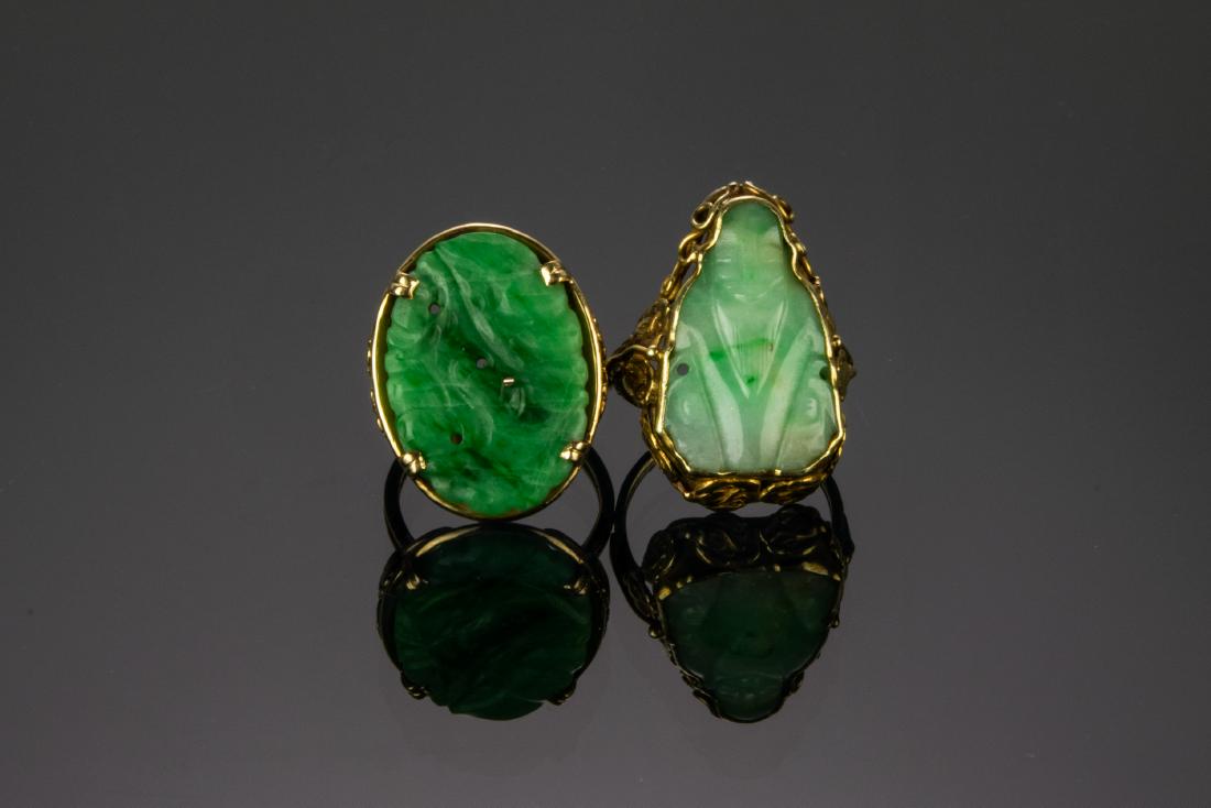 (2) 14K Gold Rings Carved Jade Panel, Ming's: (2) 14K gold rings with carved jade panels: a) Ming's Hawaii, 14K Gold Ring Carved Jade Panel. Impressed, "MINGS 14K" on inside of shank, ring size 8. Weight: 7.85 g, (0.252 troy oz). b) Custom 14K go
