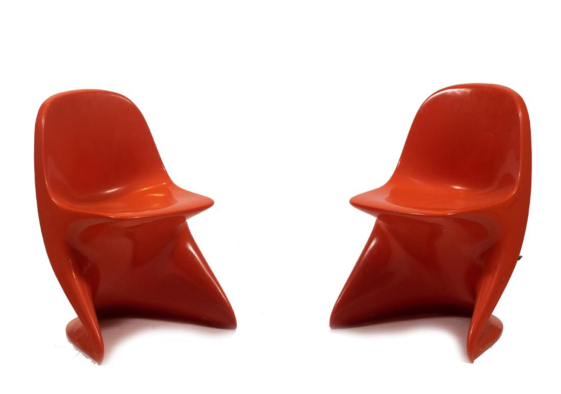 (2) Alexander Begge Casalino 1 Chairs: Pair of bright orange Aexander Begge Casalino 1 child-sized chairs, with Casalino 1 mark on back. Design from 1970-1979, produced between 1975-1978. Dimensions are: 14 inches long X 16 1/2 inches wide