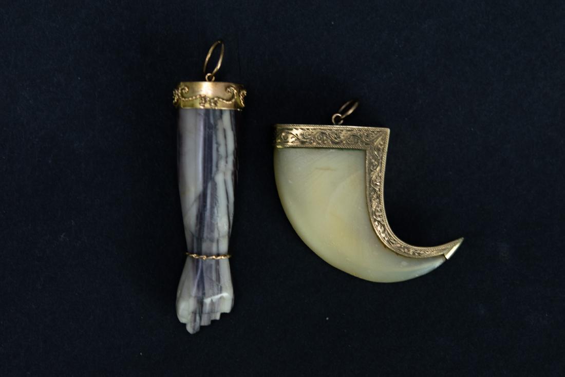 14K Gold Mounted Claw & 18K Gold Mounted Figa: 14K gold mounted claw and 18K gold mounted figa charm of colored stone; both settings are marked with their carat value. Dimensions are: claw - 1 3/8 inches long X 1 3/4 inches wide; figa charm - 1 3/