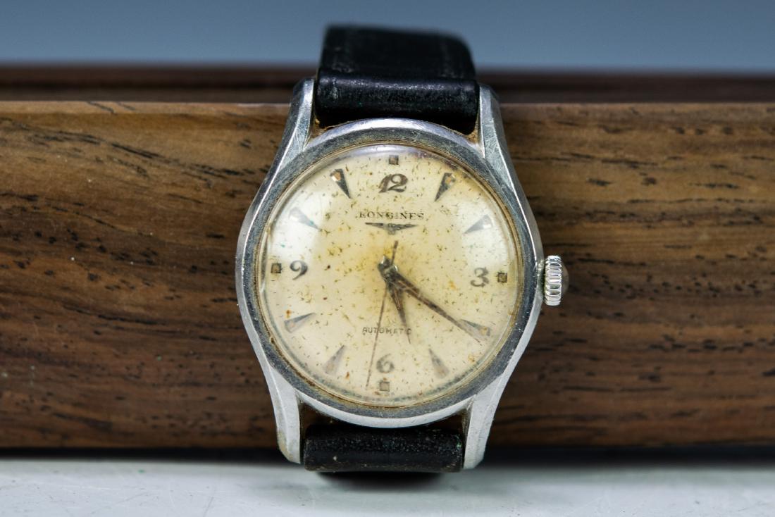 Longines Automatic Men's Wristwatch: Longines Automatic Men's Wristwatch. Watch is running. Dimensions are: Case, 35mm. All measurements are approximate. Condition: Not tested for run time or accuracy. Crystal scratched, dial has spottin