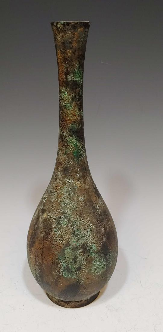 Japanese Bronze Bottle Vase: Japanese Bronze Bottle Vase: Vase has an overall green and brown patina. Dimensions are: 9 3/8 inches tall X 3 inches diameter. All measurements are approximate. Condition: Vase is free of breaks and 