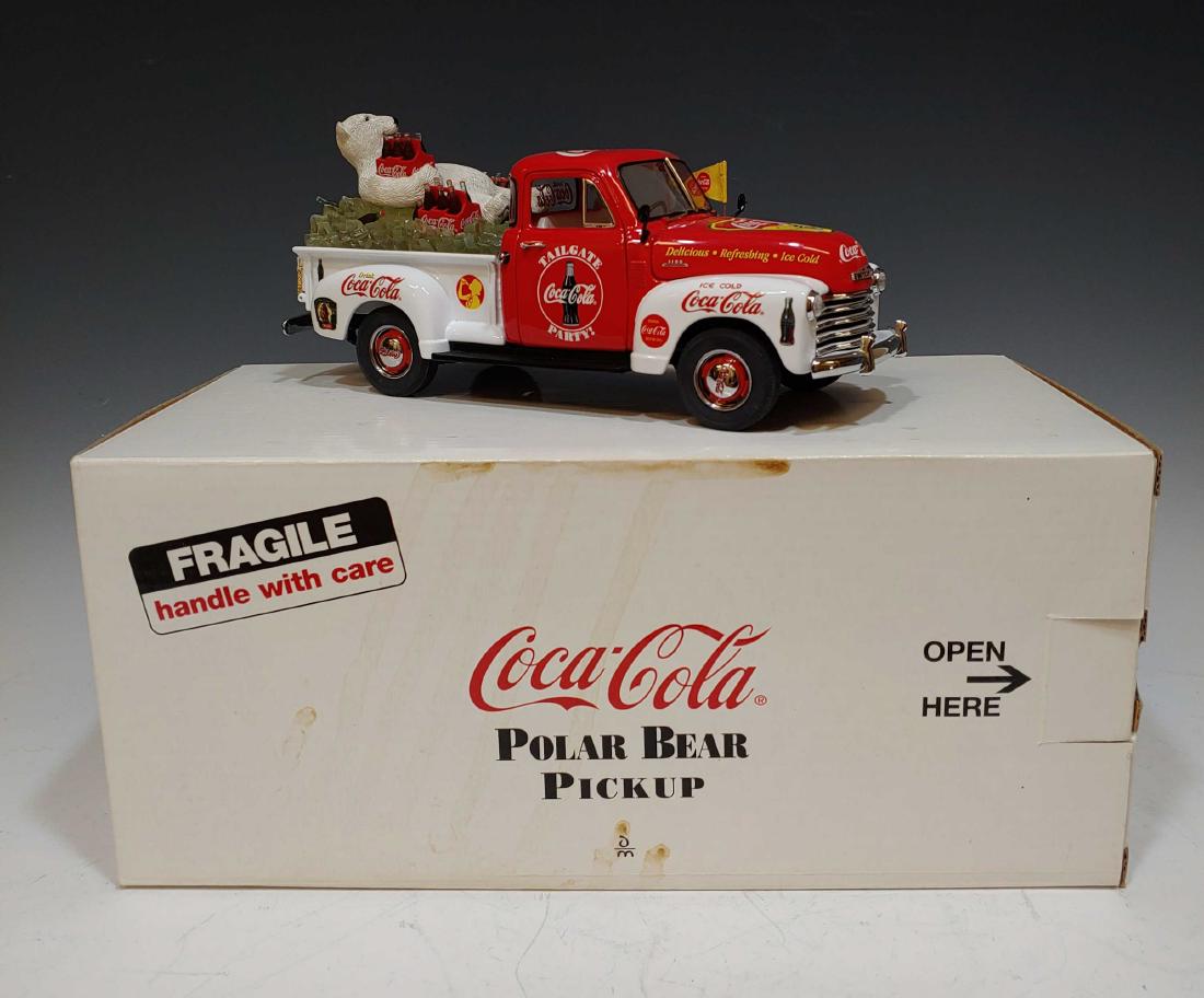 Boxed Danbury Mint Coca-Cola Polar Bear Pickup: Boxed Danbury Mint Coca-Cola Polar Bear Pickup: Comes with umbrella. Dimensions are: box - 11 3/4 inches long X 5 1/4 inches wide X 6 inches tall. All measurements are approximate.