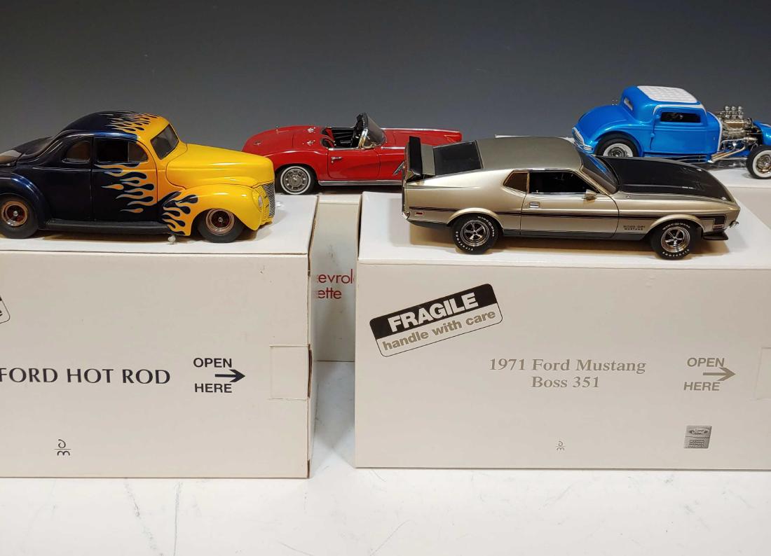 (4) Boxed Danbury Mint Hot Rods - Muscle Cars: Limited edition '32' Little Deuce Coupe, 1940 Ford Hot Rod, 1962 Corvette and a 1971 Boss 351 Mustang. Dimensions are: largest box - 10 7/8 inches long X 5 3/4 inches wide X 4 1/8 inches tall. All mea