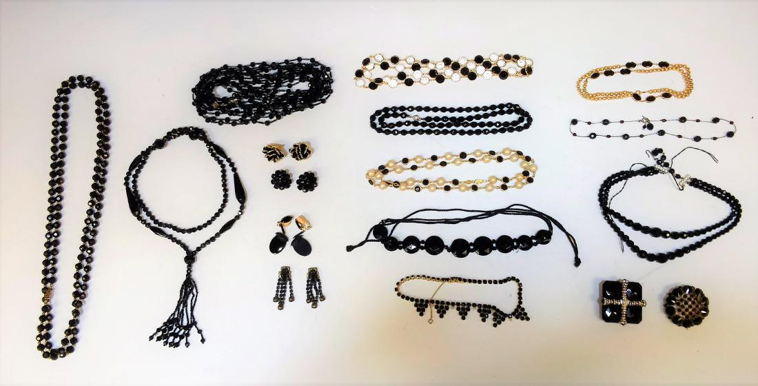 (17) Lot of Austrian & Czech Black Glass Jewelry: Includes: 9 black glass necklaces, 2 plastic necklaces, 2 brooches, and 4 pairs of earrings. Dimensions are: longest necklace - 55 inches long, smallest earrings - 1 inch dia. All measurements are app
