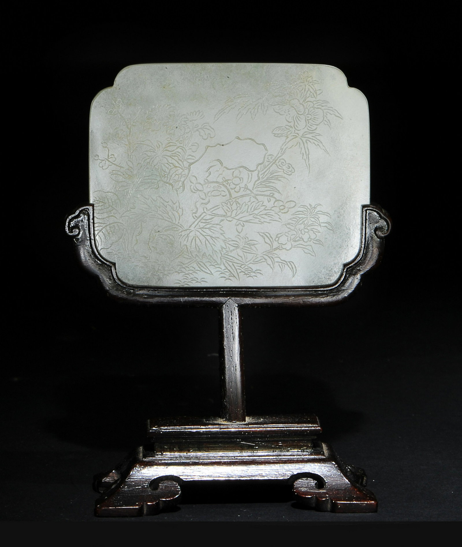 Chinese White Jade Belt Buckle with Stand, 18th Century: A Chinese white jade belt buckle with a wood stand and dating from the 18th century. There are 2 cicadas carved with high relief on the back, while the front is incised with flowers. Dimensions are: t