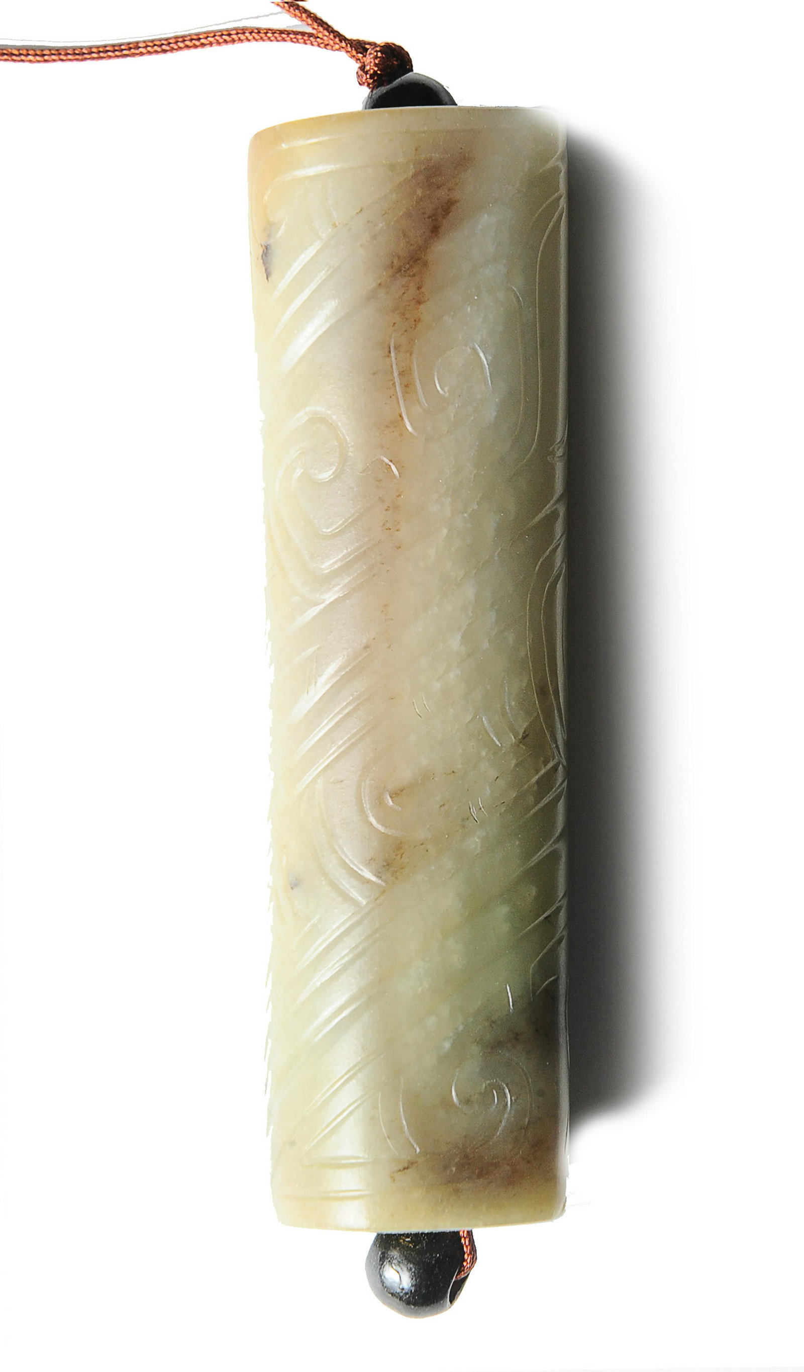Chinese Jade Toggle, Western Zhou Dynasty: 西周 玉勒子 A Chinese jade cylinder toggle carved with slanting ruyi bands and dating from the Western Zhou dynasty. Dimensions are: 3 3/8 inches tall X 1 1/8 inches wide