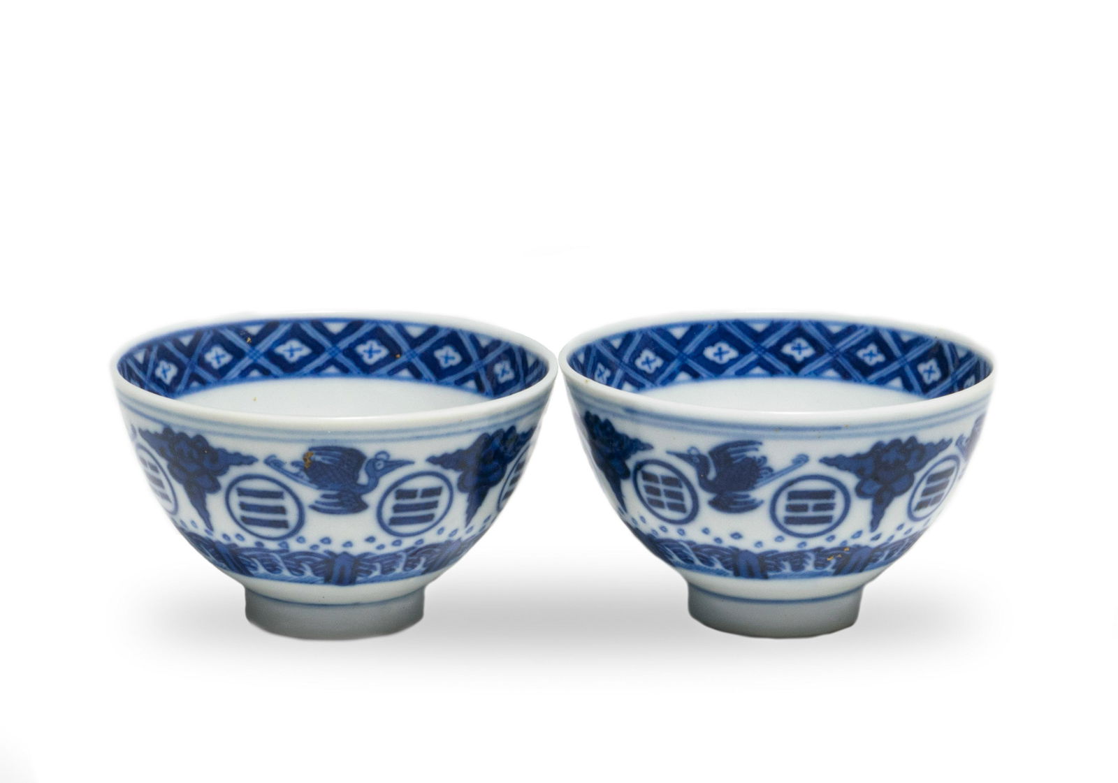 Pair of Imperial Blue & White Cups, Guangxu: A pair of Imperial Chinese blue and white teacups, each with 6-character Guangxu mark on the bottom and of the period. The bodies feature cranes among ruyi clouds and bagua over a wave and rock motif