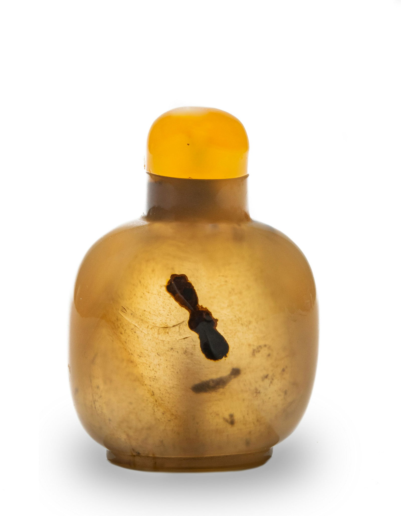 Chinese Agate Snuff Bottle, 19th Century: A Chinese agate snuff bottle with an agate stopper. Dates from the 19th century. The snuff bottle is incised with a dragonfly on one side and a duck on the other. Dimensions are: 2 3/4 inches tall X 1