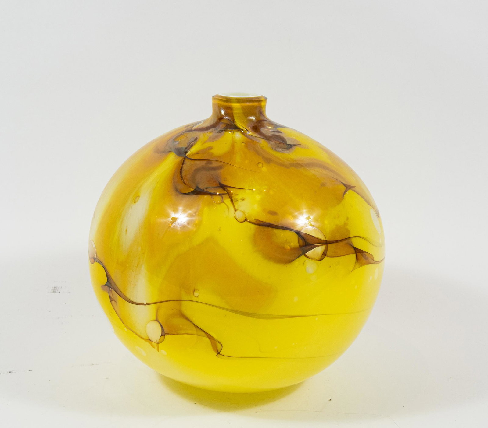 Kent Ipsen Large Studio Art Glass Vase: Kent Ipsen (American, 1933-2012), large spherical studio art glass vase in yellow with molten caramel streaks, 1980. Artist signature and date on base. Dimensions are: 13 1/2 inches diameter X 13 inch