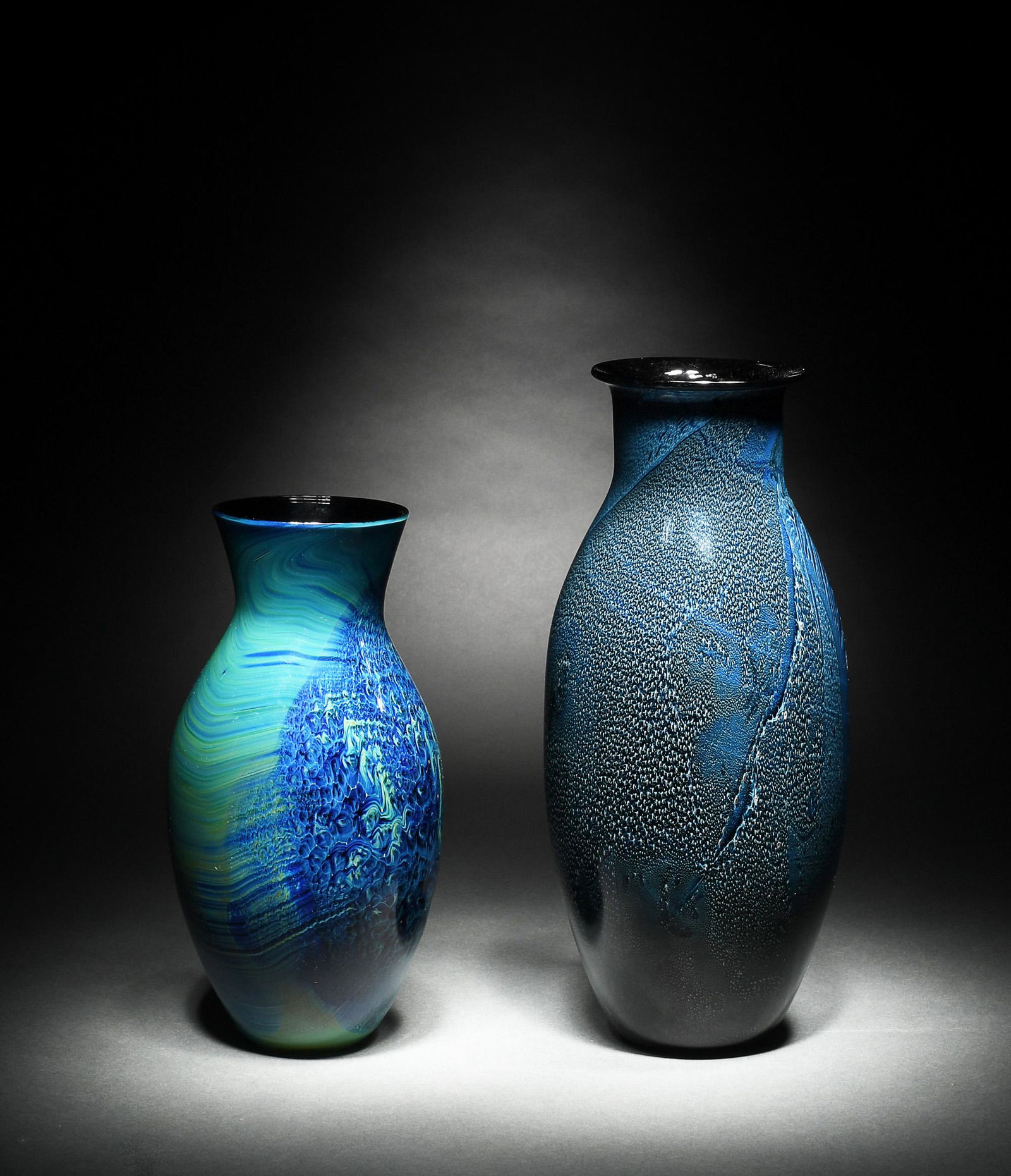 (2) Josh Simpson Art Glass Vases: (2) Josh Simpson (American, b. 1949) green-blue art glass vases, early 21st century. Incised on underside with artist signature and possibly date or production number: on taller vase, "11.34.01" and o