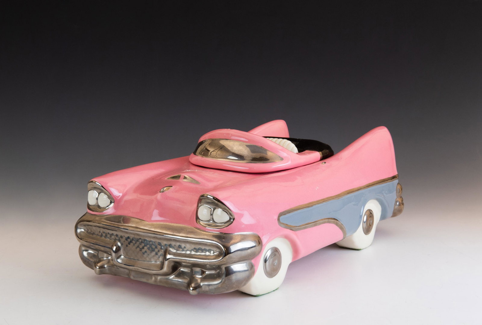 Glenn Appleman Ford Fairlane Cookie Jar: Glenn Appleman (American, 20th century) ceramic cookie jar in the shape of a pink Ford Fairlane with black, gray, and silver trim. Signed Appleman 1981 and incised QJ on base. Dimensions are: 15 7/8 i