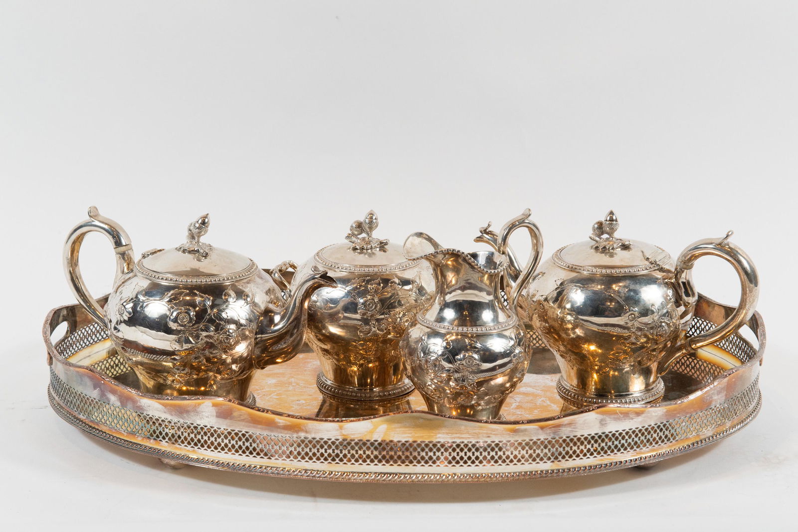 (4) Coin Silver Tea Set by Jones, Ball & Co Boston: (4) piece coin silver tea set by Jones, Ball & Co. Boston, American, circa 1830. Two teapots, one marked "Jones, Ball & Co." the other marked "Jones, Shreve, Brown & Co." (this piece circa 1850). Crea