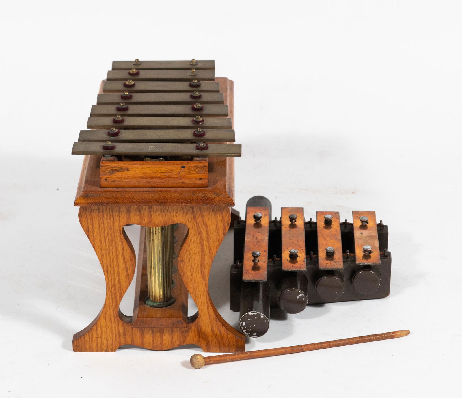 (2) Small Xylophones inc. J C Deagan: (2) small xylophones, including four note dinner chimes manufactured by J. C. Deagan, Inc. (Chicago, 1880-1978) and an oak mounted eight note xylophone. Dimensions are: largest - 15 inches wide X 8 in