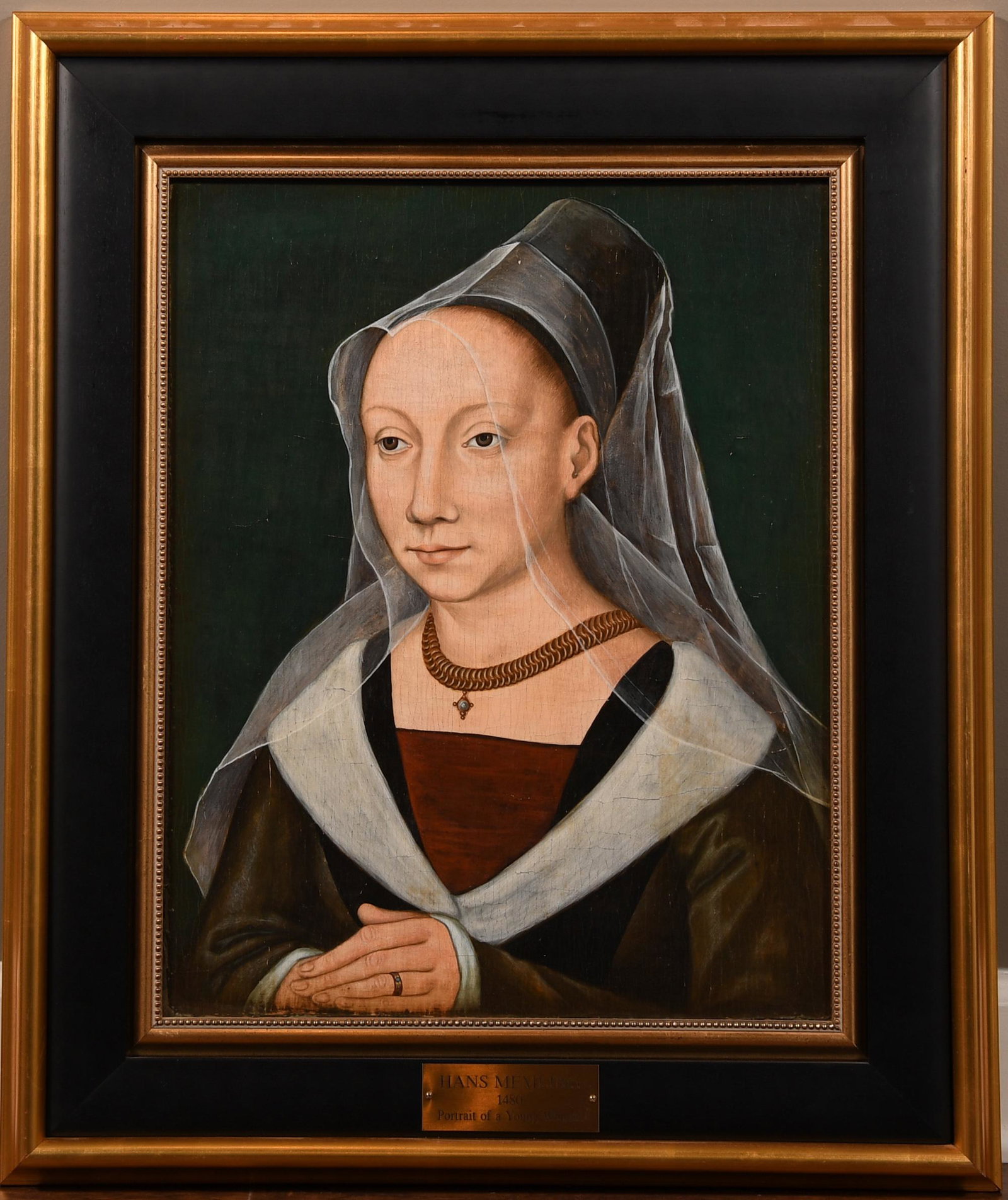 After Hans Memling Portrait of a Young Woman: After Hans Memling (c. 1430 â€“ 1494), oil on panel, "Portrait of a Young Woman," 19th-20th century copy after a 1480 original. Dimensions are: sight size - 15 1/4 inches wide X 19 1/4 inches tal