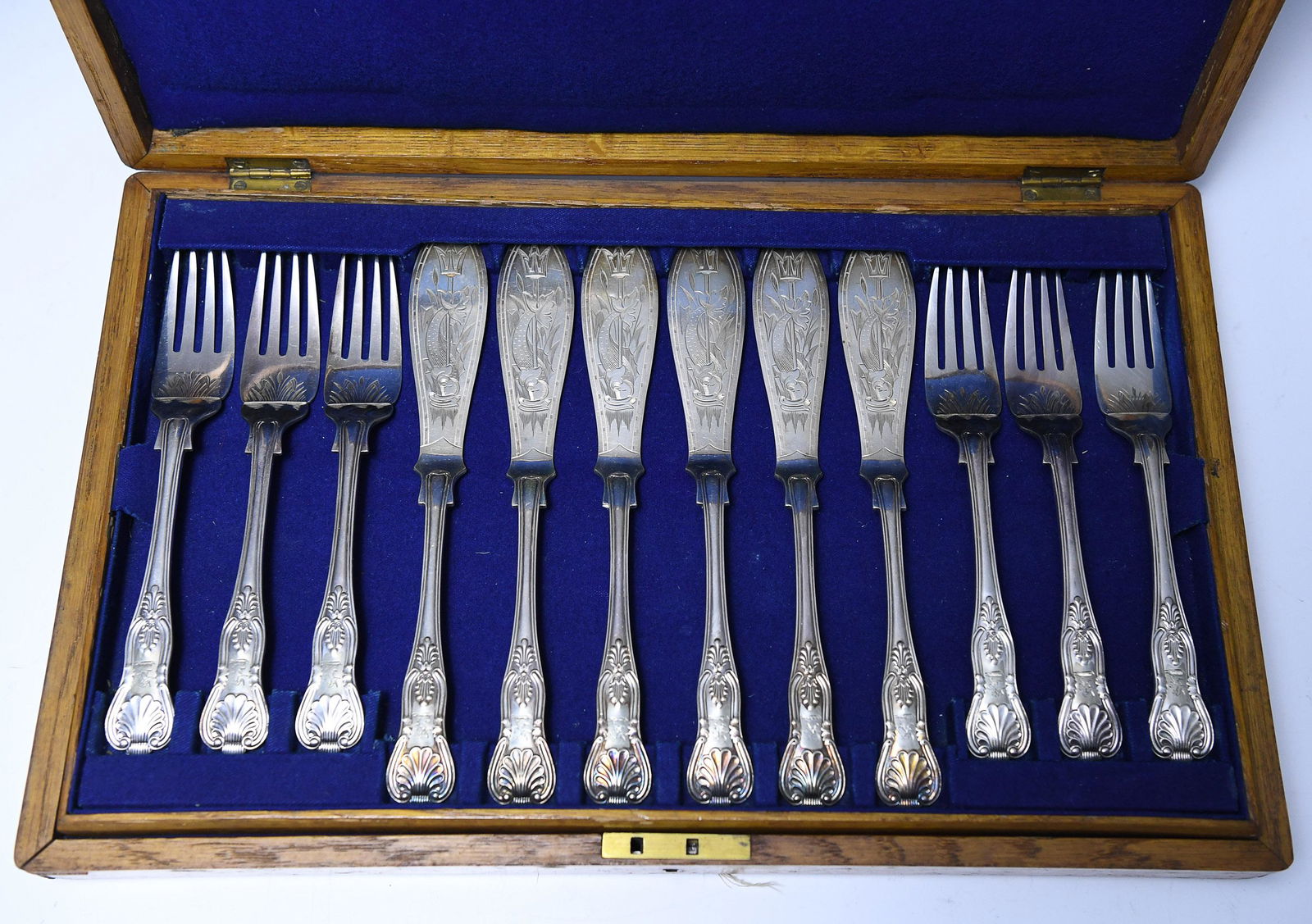 Set of (12) Fish Knives & Forks, Mappin & Webb S&L: (12) piece cased set of silver plate fish knives and forks by Mappin & Webb, Sheffield & London: 6 knives and 6 forks, each chased with floral motif with trident on flat of knife blades and handles wo