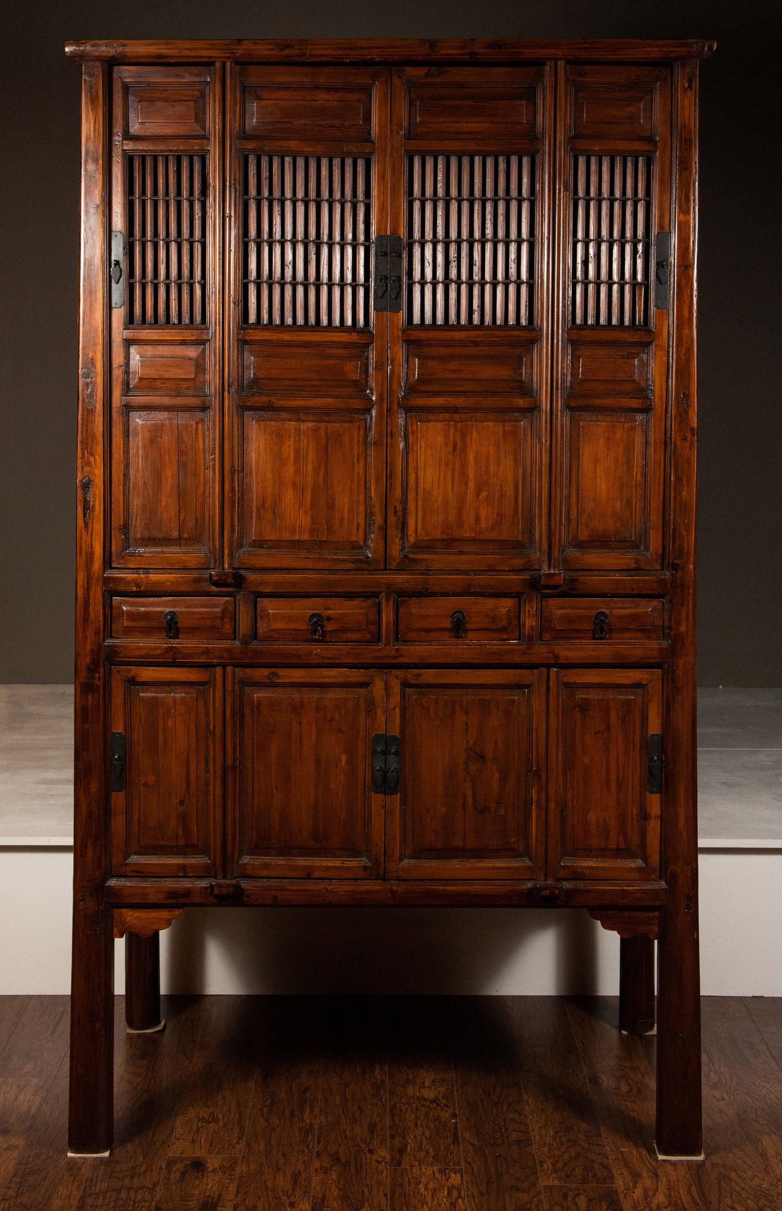 Chinese Elm Kitchen Cabinet, 19th C: Chinese elm kitchen cabinet from the 19th century. There are two sets of four doors which are separated by four drawers. Dimensions are: 41 inches long X 20 inches wide X 74 inches tall. All measureme