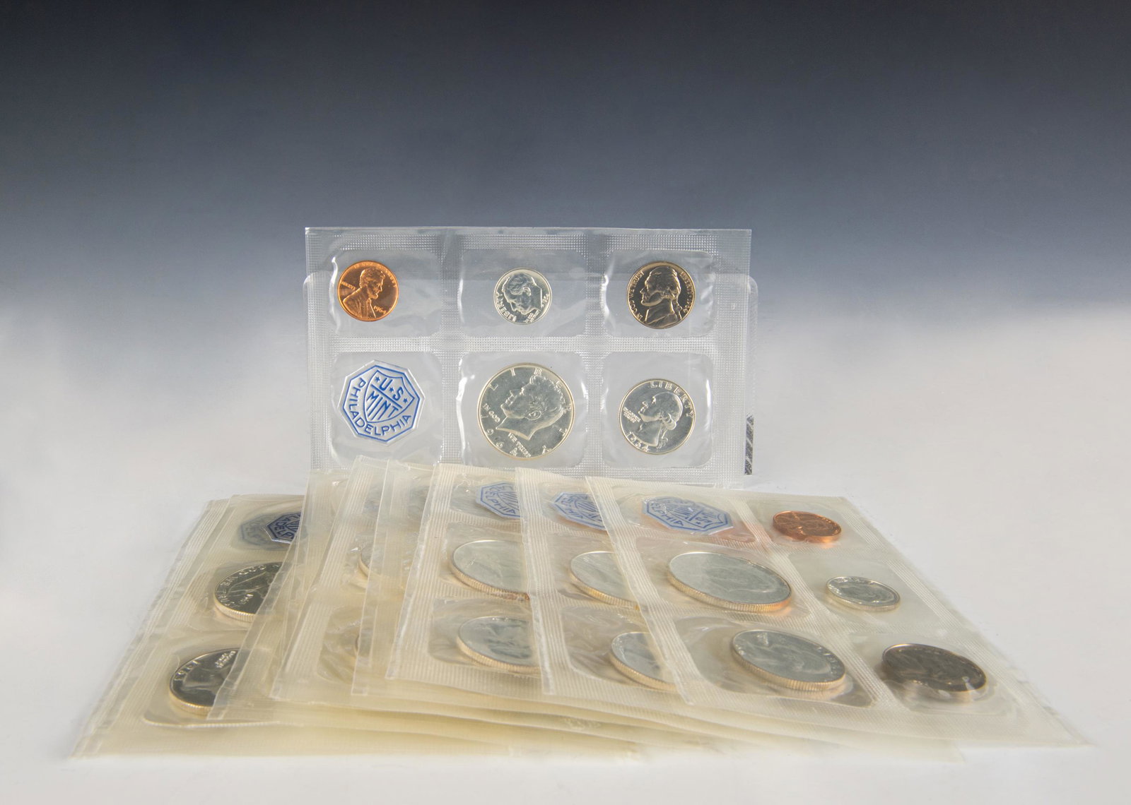 (10) Sealed US Mint Sets 1963 & 1964 Silver Coins: (10) sealed US Mint Sets 1963 & 1964 Silver Coins: (5) 1963 sets including a penny, dime, nickel, quarter, and half dollar with Benjamin Franklin. (5) 1964 sets including a penny, nickel, dime, quarte