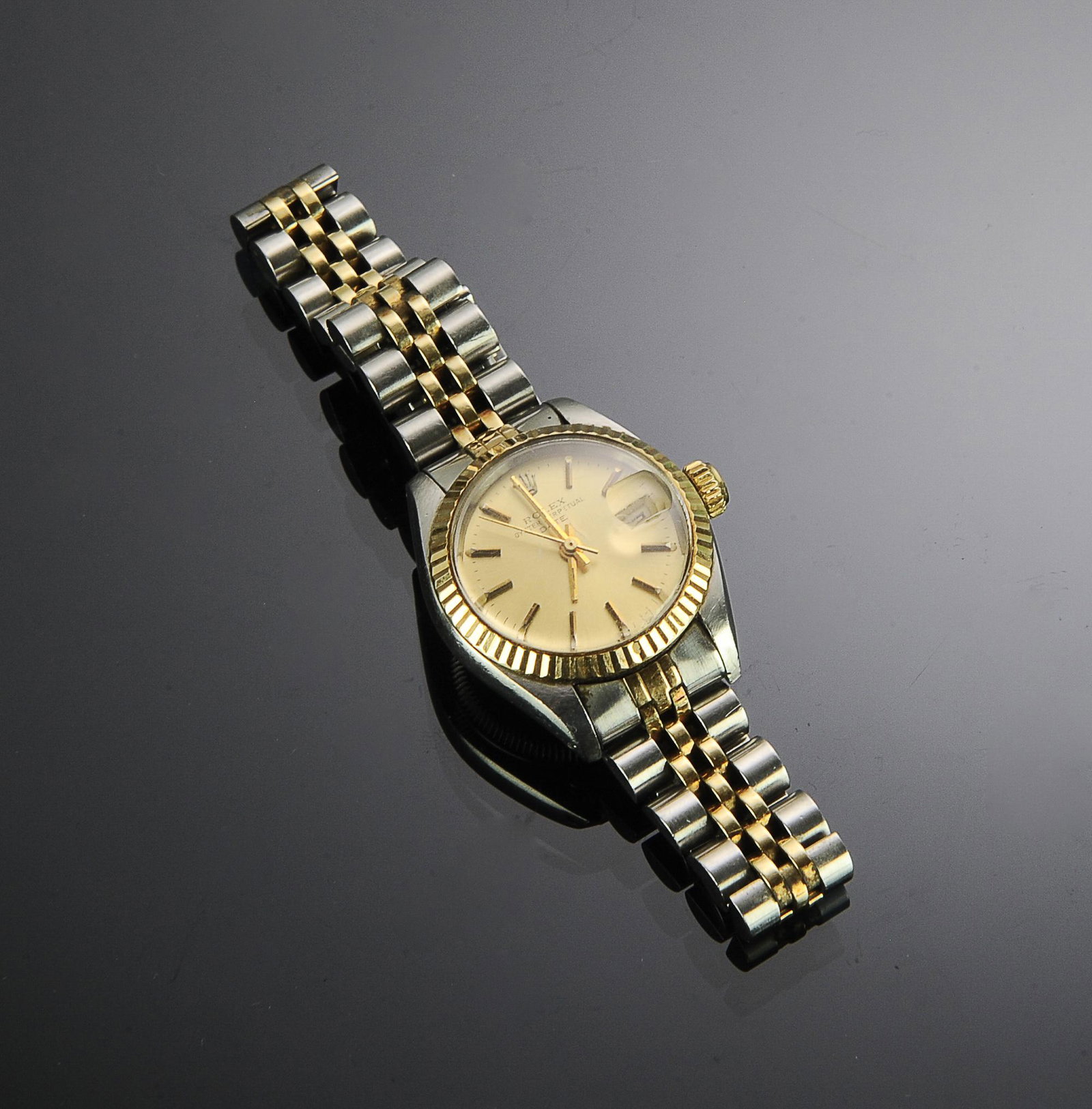Rolex 18K Gold & Stainless Ladies Chronometer: Rolex 18K gold and stainless steel ladies' perpetual date wristwatch chronometer: Movement: perpetual, self-winding chronometer dial; "Champagne" gold dial with applied gold indexes. Case Material: Fl