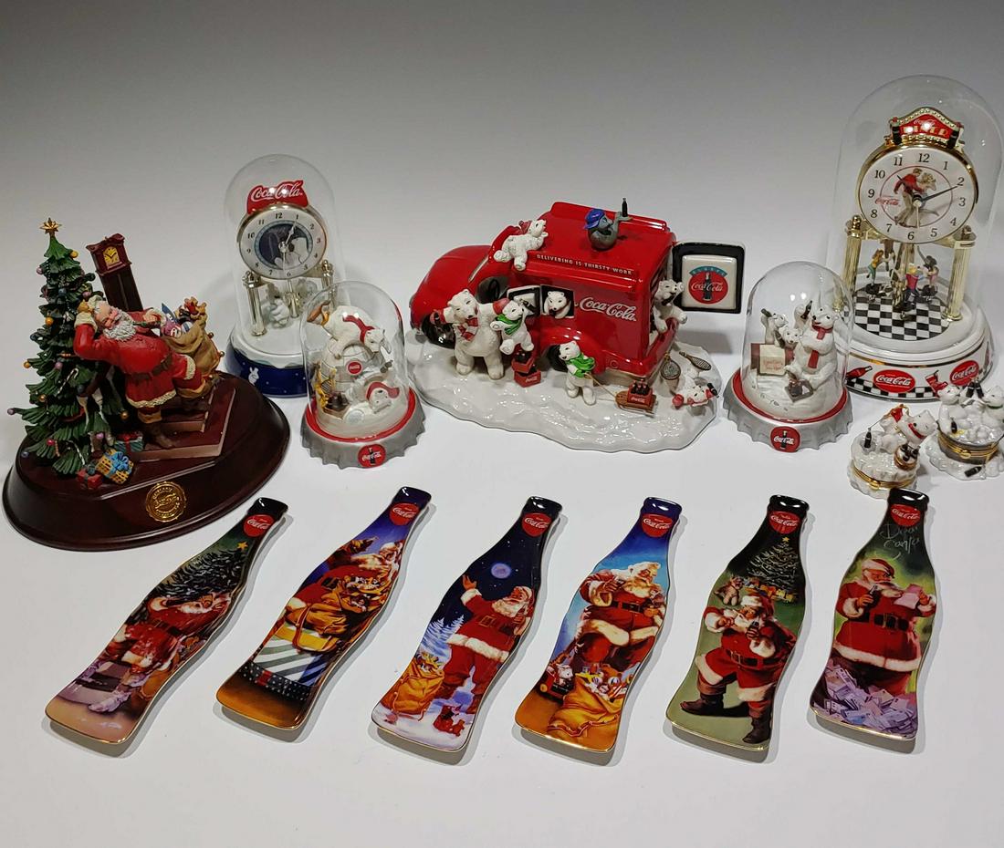 (14) Franklin Mint Coca-Cola Christmas Items: (14) Franklin Mint Coca-Cola Christmas items: a) Coca-Cola musical delivery truck on snow with mother bear with six cubs and seal on top; b) (6) Santa theme spoon rests with six different classic Sant