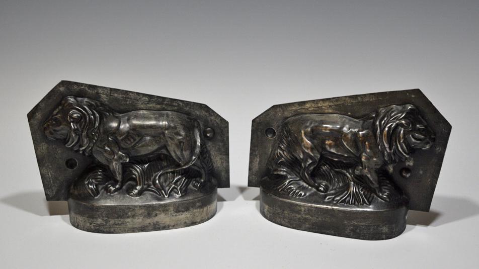 Lion-Form Tin Chocolate Mold, 19th Century: Lion-form tin chocolate mold dating to the 19th century. Mold is constructed of thin steel in two parts converging in the center of the figure. The mold has two points of alignment on both forms and o