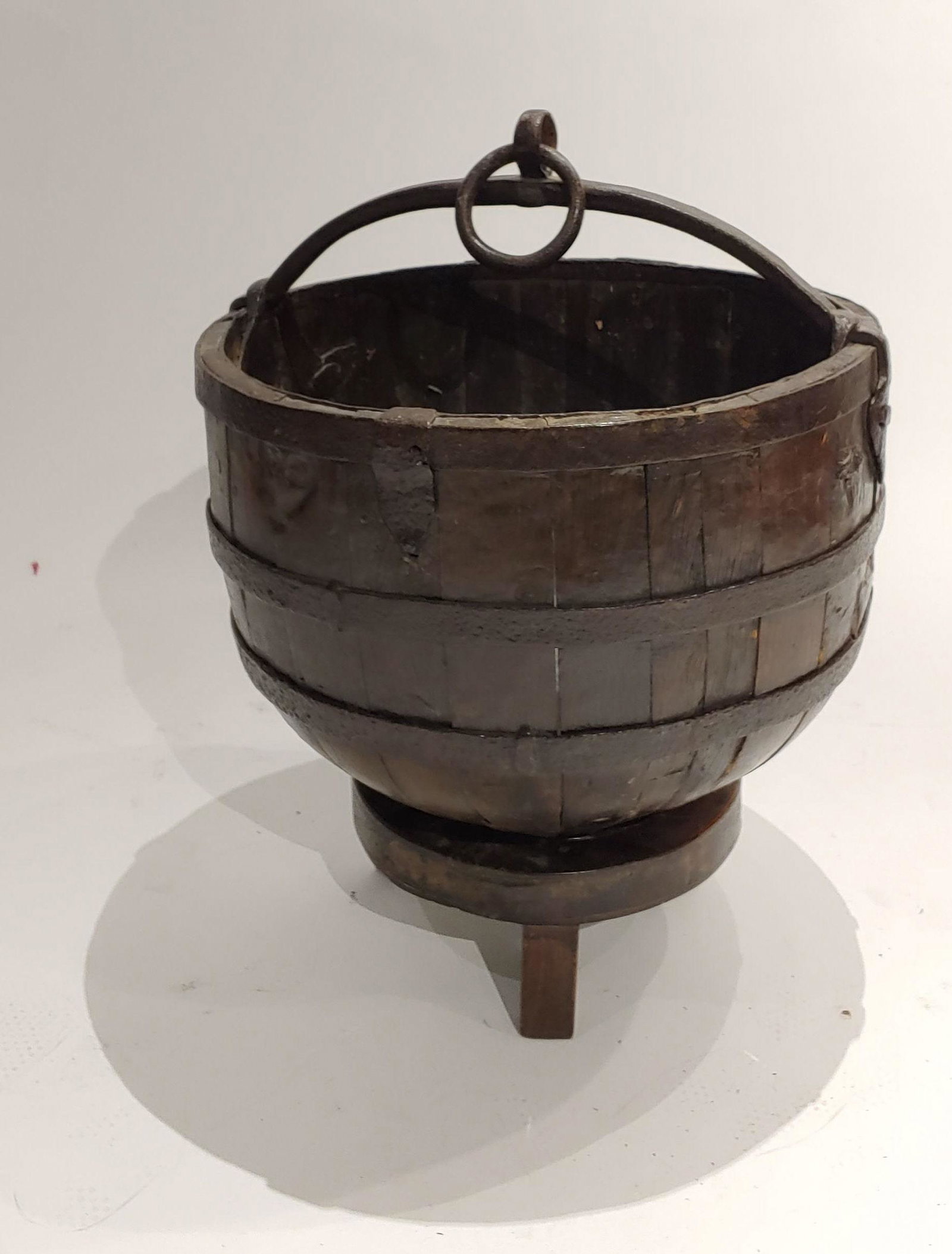 Antique Wood & Iron Fireplace Pot on Stand: Antique wood & iron fireplace pot on stand: pot and stand are made of wood with metal fittings. Dimensions are: 18 1/8 in (46 cm) diameter X 23 in (58.4 cm) tall. All measurements are approximate. Con