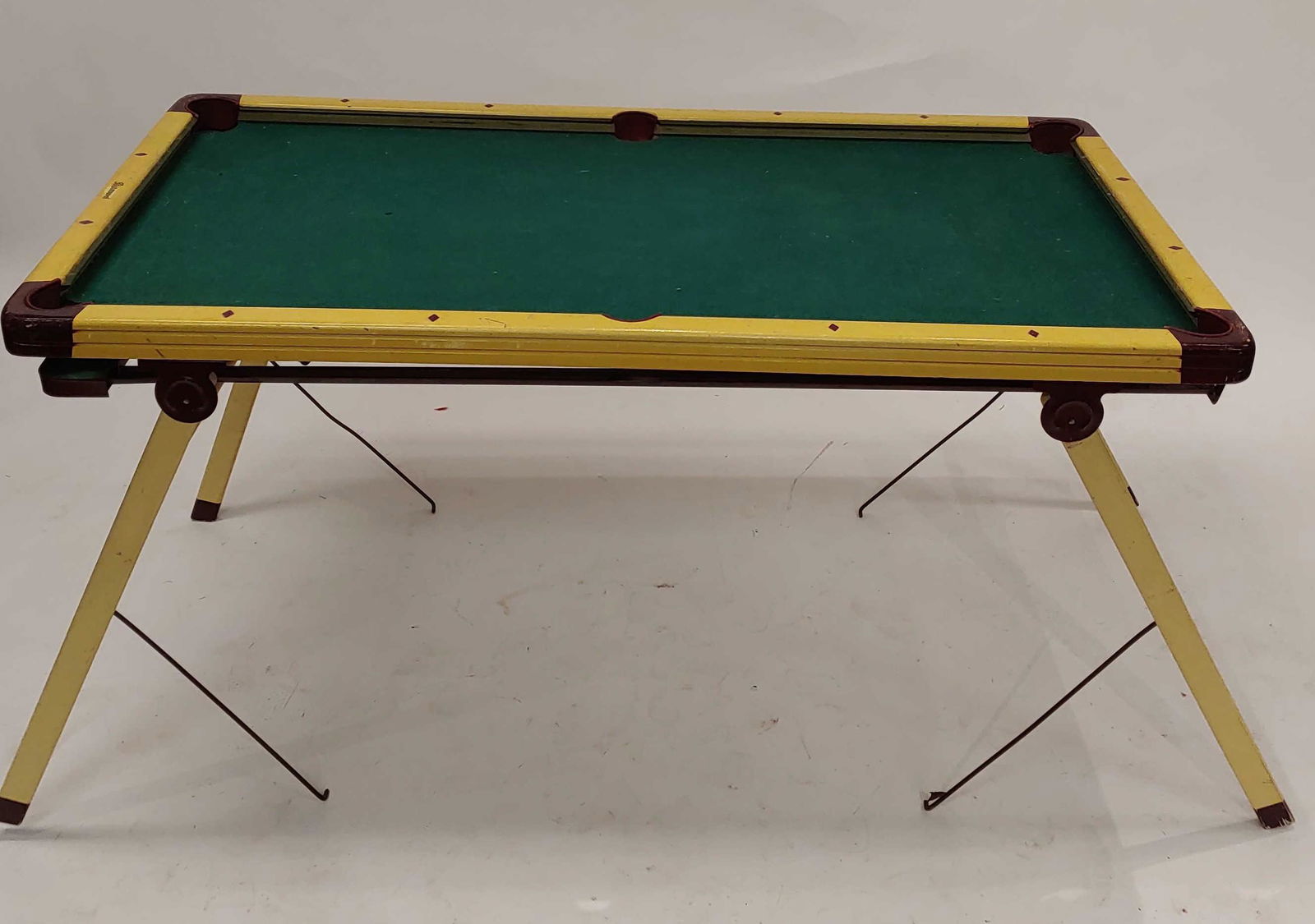 Boxed Folding Billiards - Pool Table by Burrowes: Boxed folding billiards - pool table by Burrowes. The table is marked Burrowes and comes with 31 pool balls, chalk, 2 triangles, and 2 pool sticks. Dimensions are: of box - 50 1/2 in (128.3 cm) long X
