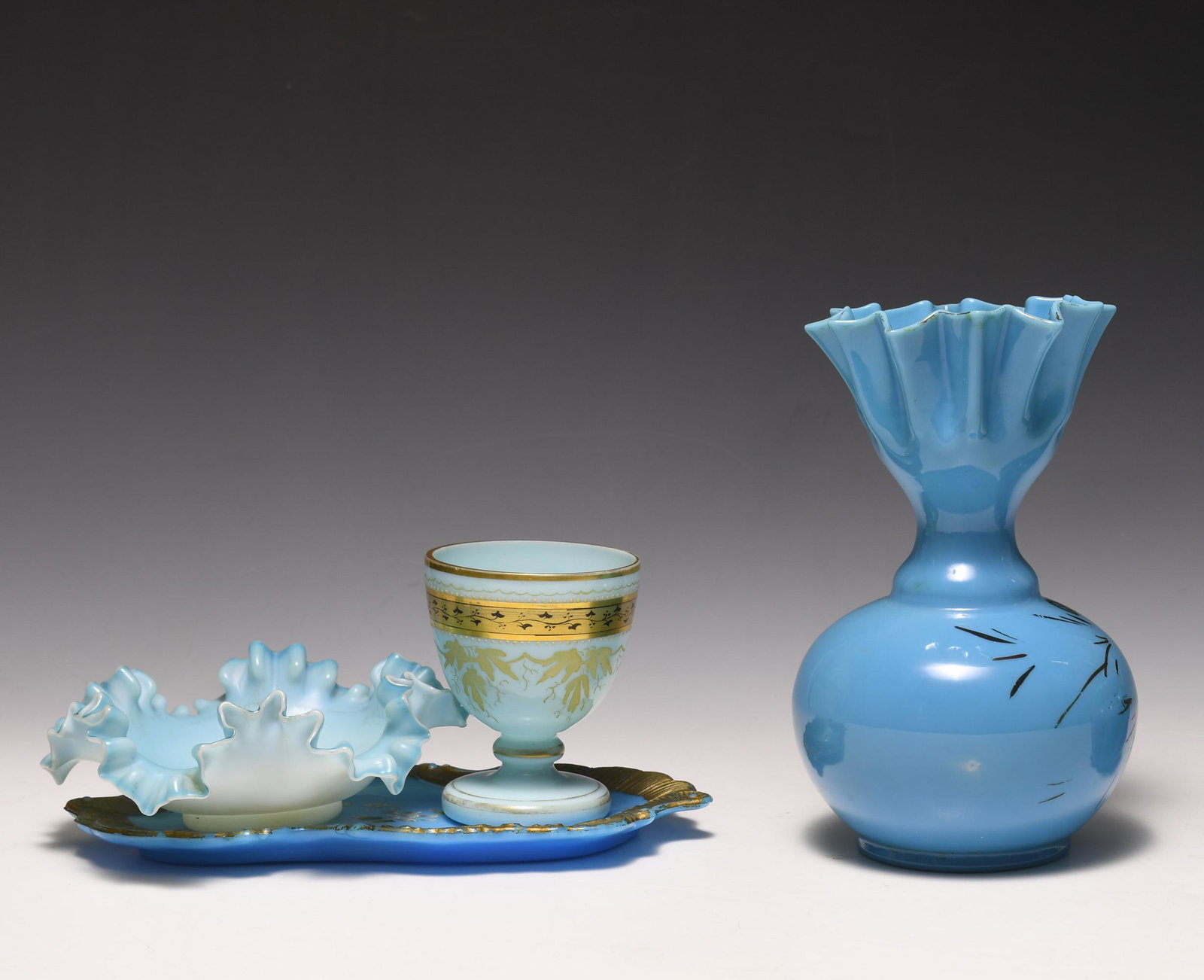 (4) Pieces of Blue Victorian Art Glass: (4) pieces of blue Victorian art glass including: a) blue free blown vase with decoration to body, crimped edge, and pontil mark possibly by Thos. Webb; b) fluted bowl with pontil marks possibly by Th