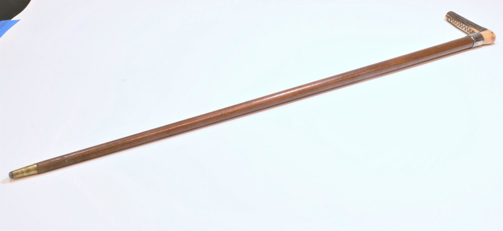 19th Century Wood Cane with Sterling Silver Collar: Wood cane with a collar made of British Chester sterling silver, circa 1893. Collar is engraved: W. J. Harvey, 1894. Handle is made of celluloid and the ferrule is made of gold tone metal. Dimensions 