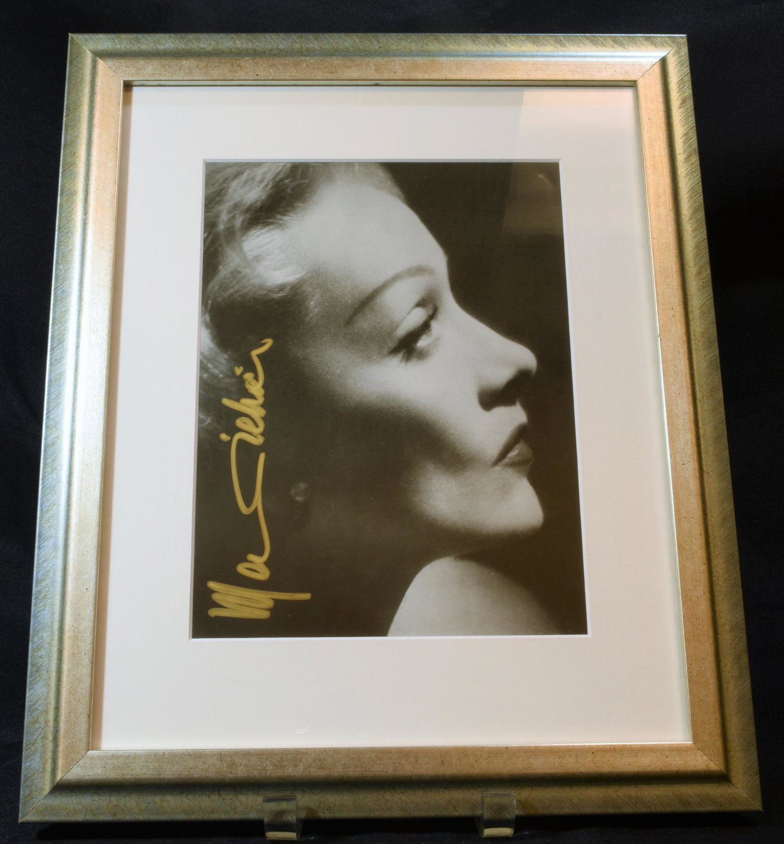 Marlene Dietrich Signed Photo with Cert.: Signed photo of German-American actress Marlene Dietrich with authentication certificate attached to frame. Marie Magdalene "Marlene" Dietrich was a German-American actress and singer, active from the