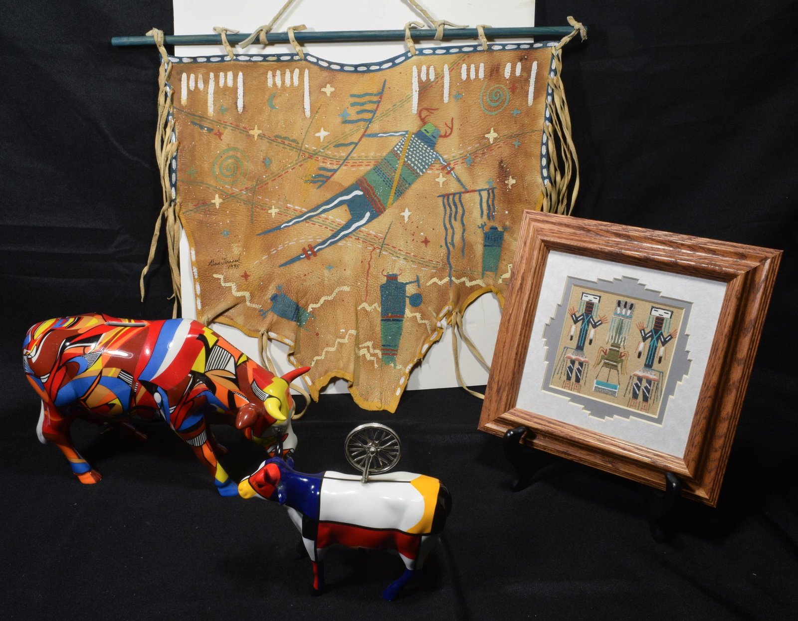 (4) Darlene Johnson Navajo Sand Painting & Others: (4) Darlene Johnson Navajo sand painting and others. Comes with a buffalo hide painting by Alan Jiranek titled Ancient Sky Journey and dated 1995. Also includes two Cow Parade pieces: No. 7462 Psycowd