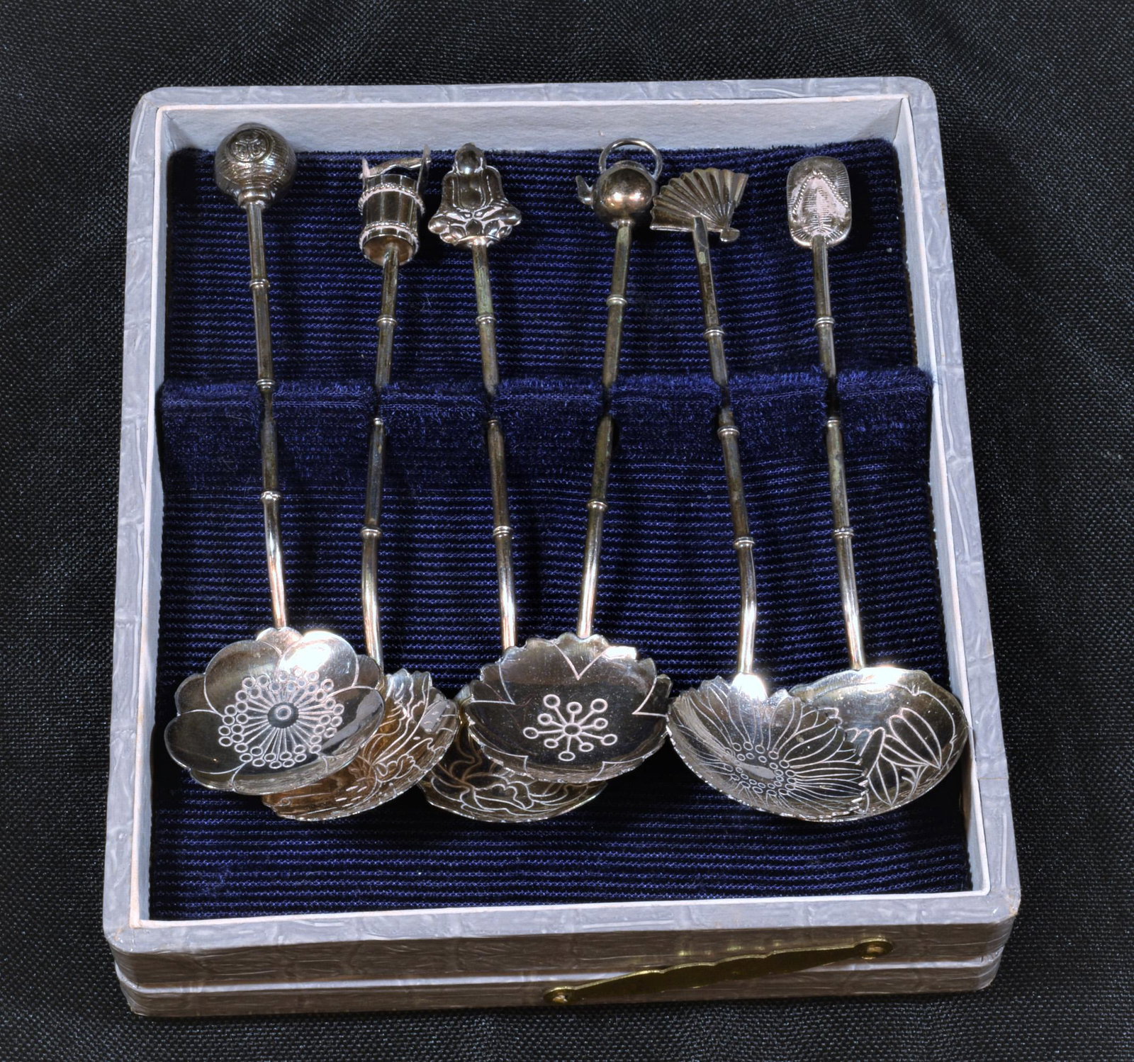 Japanese 950 Sterling Silver Demitasse Spoons: Japanese 950 sterling demitasse tea / coffee spoons: each with the image of a flower in the bowl, bamboo form handle and sculptural knob including a lantern, bucket, fan, Buddha, sandal and teapot. Ea