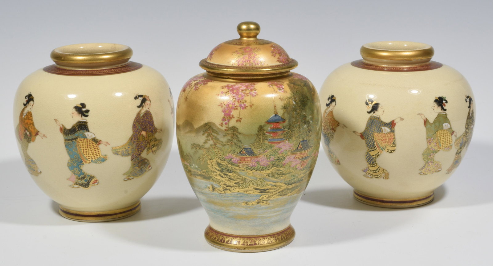 (3) Japanese Satsuma Porcelain Vases Meiji Period: (3) Japanese Satsuma porcelain vases from the Meiji period: a) two vases, each hand-painted with eight frolicking geisha, with a mark on the bottom; b) lidded vase, the body hand-painted and gilded wi