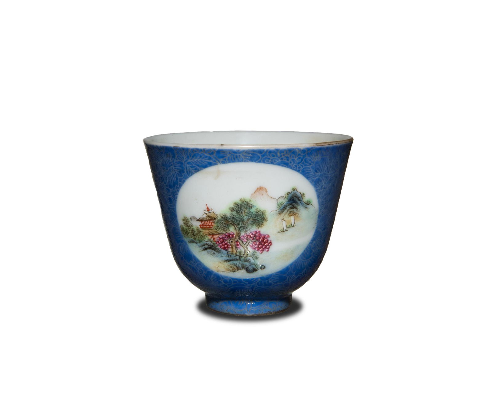 Chinese Blue-Ground Famille Rose Cup, Republic: A Chinese blue ground etched cup dating to the Republic period. The cup is decorated with two famille rose landscape roundels and has a four character mark on the bottom. Dimensions are: 2 1/4 in. tal