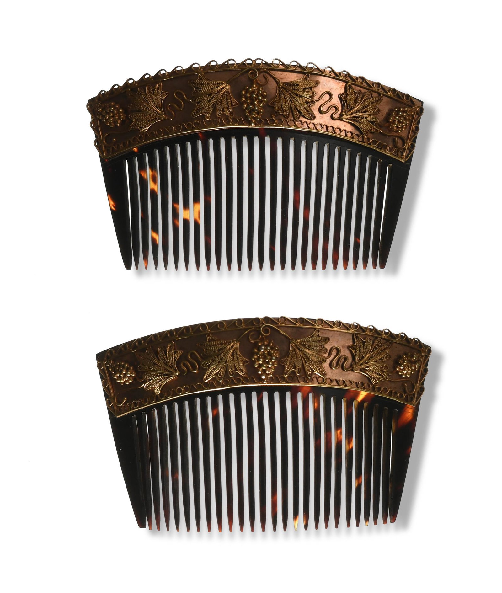 2 Faux Tortoise Shell & 14K Gold Hair Combs: Faux tortoise shell. The gold pattern depicts leaves and bunches of grapes. Dimensions: 2 inches tall X 3 1/4 inches wide; 5.1 cm tall X 8.3 cm wide. All measurements are approximate. Condition: A sma