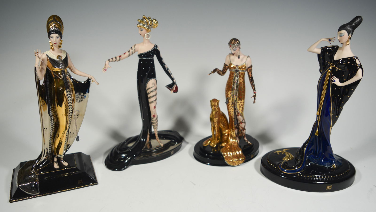 Franklin Mint & Erte, 4 Boxed Porcelain Figures: The Franklin Mint (American, founded 1964) and House of Erte, porcelain. 4 porcelain figures all come with the original boxes and certificates. Includes: 'Moonlight Mystique,' 'Pearls and Rubies,' 'Oc