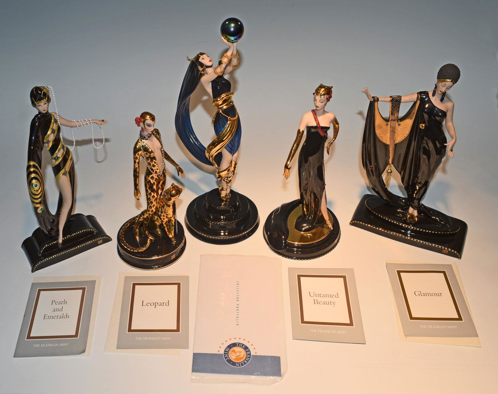 Franklin Mint & Erte, 5 Boxed Porcelain Figures: The Franklin Mint (American, founded 1964) and House of Erte, porcelain. 5 porcelain figures all come with the original boxes and certificates. Includes: 'The Globe,' 'Pearls and Emeralds,' 'Glamour,'