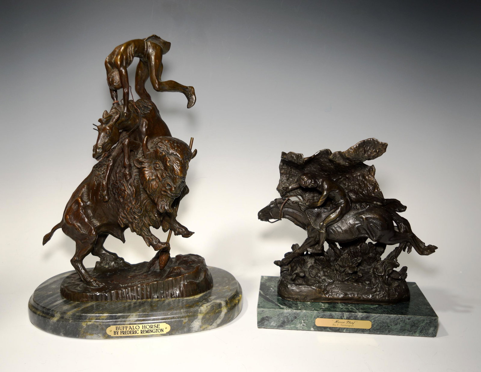 Frederic Remington, 2 American Indian Bronzes: Frederic Remington (American, 1861-1909) bronze. Later castings of 'Horse Thief' and 'Buffalo Horse.' Both of the statues are signed at the foot, mounted on a base, and feature a plaque with the artis