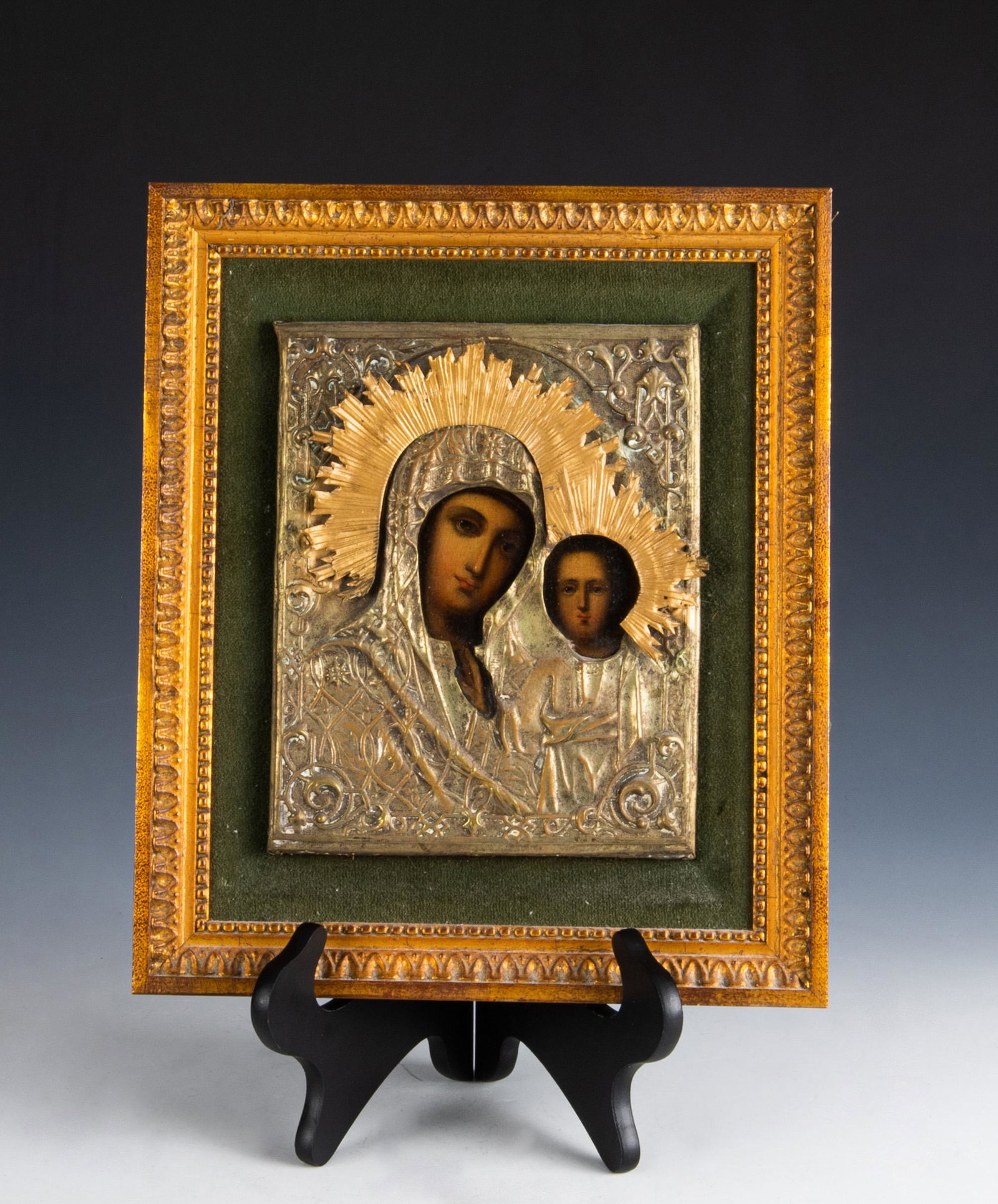 Russian Icon Painting Kazanskaya: Russian egg tempera on wood icon painting under silvered brass riza, depicting the Madonna as the Theotokos, with the Christ Child standing in her lap. The format of the icon resembles the Russian ico