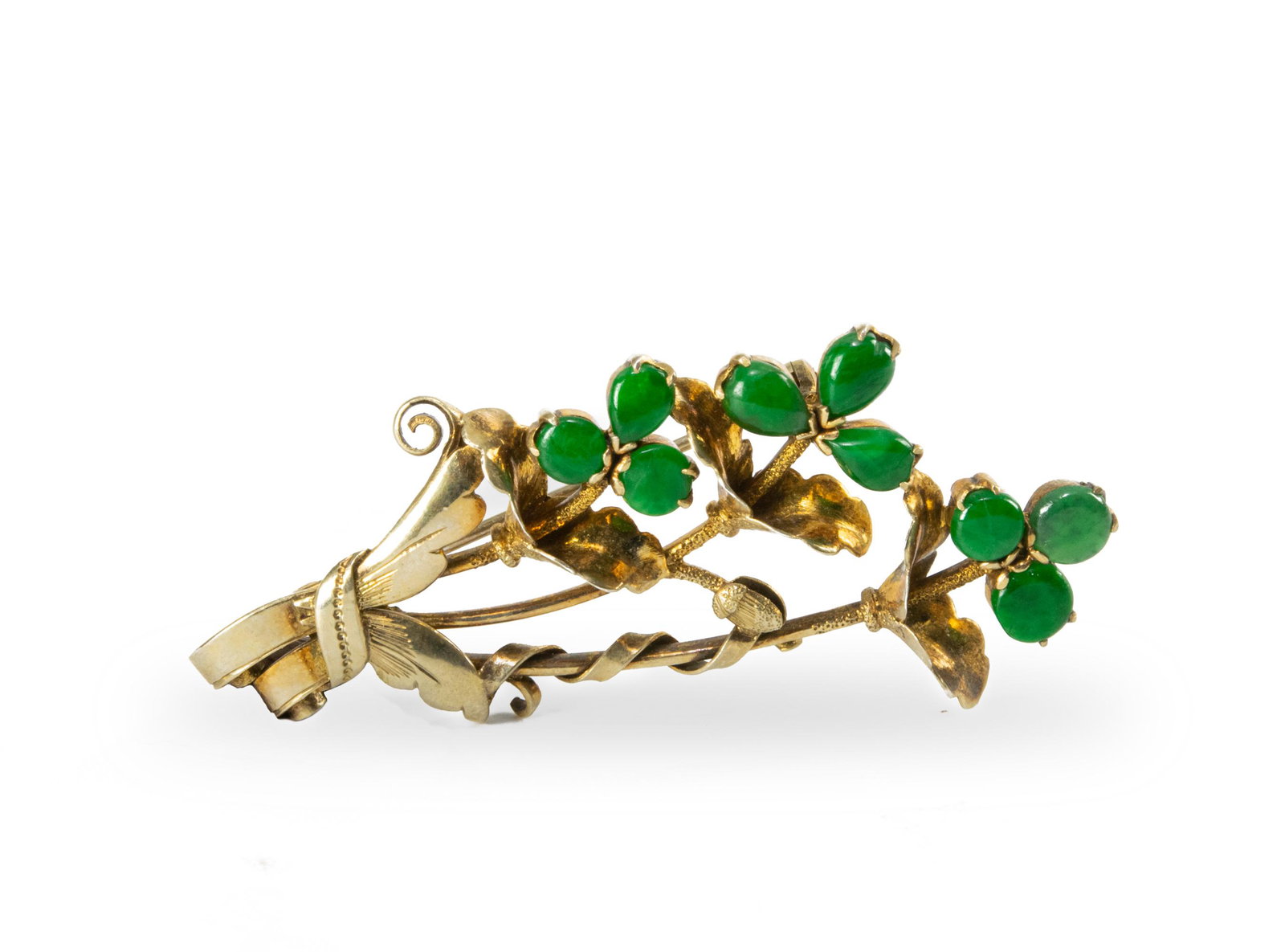 Chinese Brooch with 9 Jadeite Cabochons, Republic: A Chinese bouquet brooch with nine green jadeite cabochons. Dates from the Republic period. The mark on the back has been rendered illegible. Dimensions: 2 1/2 inches tall X 1 inches wide; 6.4 cm tall